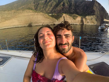 Portrait of smiling friends in lake