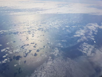 Aerial view of frozen sea against sky