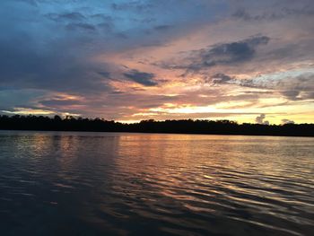 Scenic view of lake at sunset