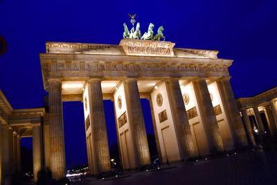 Low angle view of historical building at night