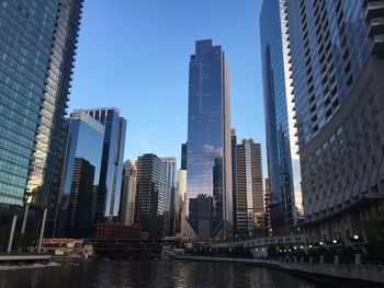 Modern buildings in city against sky