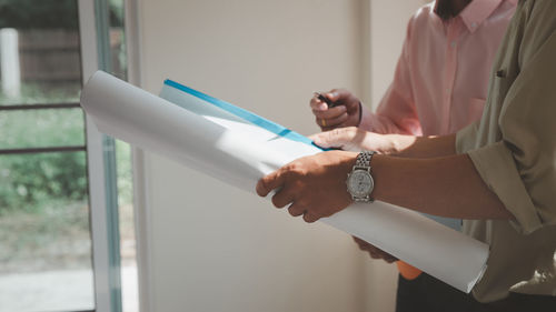 Midsection of man working at home