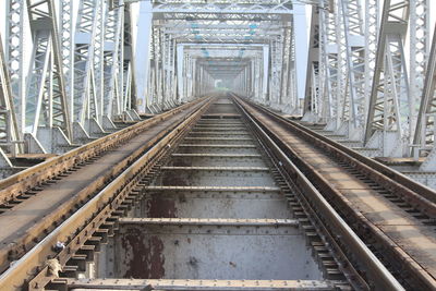 Railway tracks along bridge