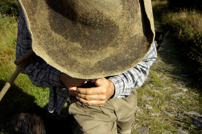 High angle view of man holding umbrella