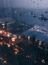 Full frame shot of raindrops on glass window