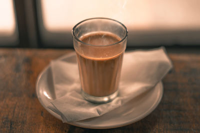 Close-up of tea in glass on table