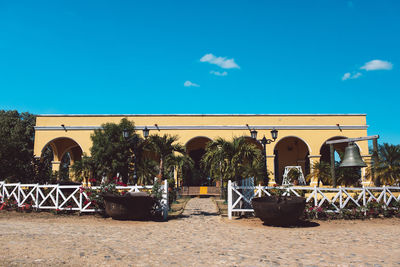 Chairs and tables against blue sky