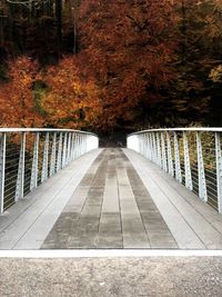 Footbridge over footpath during autumn