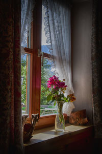 Flower vase on window sill