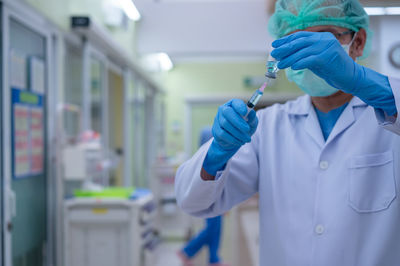 Rear view of people working