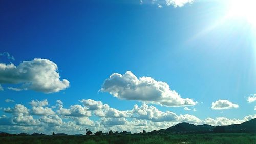 Scenic view of landscape against cloudy sky