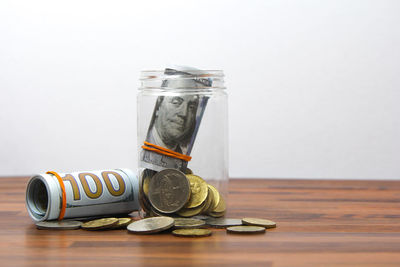 Close-up of coins on table