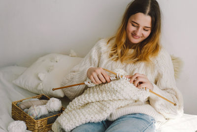 Teengirl knitting at home. handmade and hobby.