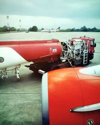 Close-up of red boat against sky