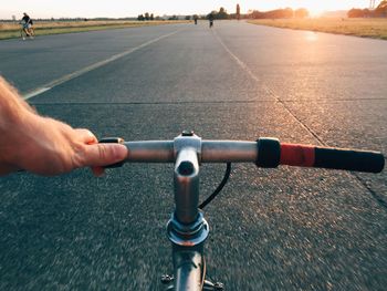 Cropped image of man holding road