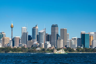 Sydney central business district cityscape with ferry boat. modern urban skyline, smart city 