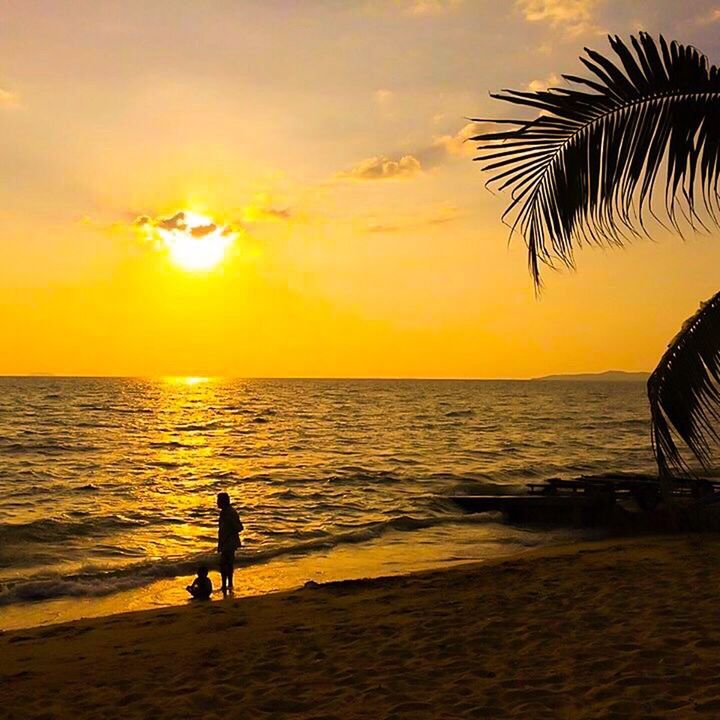 sunset, sea, beach, vacations, outdoors, silhouette, tourism, water, sun, nature, people, sky, horizon over water, palm tree, one person, beauty in nature, adult, human body part, day