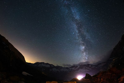 Idyllic view of mountains against sky at night