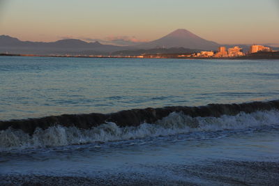 Scenic view of sea against sky at sunset