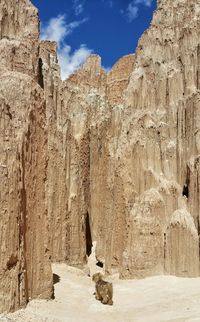 Low angle view of rock formation against blue sky