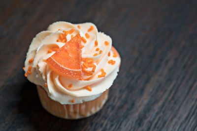 Close-up of cupcake served on table