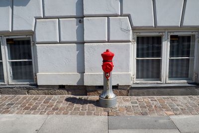 Red umbrella on window