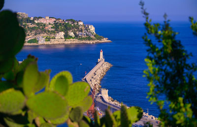 High angle view of sea and buildings in city