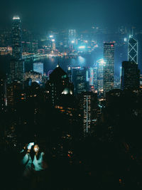 High angle view of illuminated city buildings at night