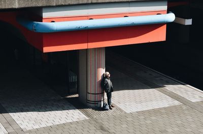 Man standing on mobile phone