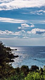 Scenic view of sea against cloudy sky