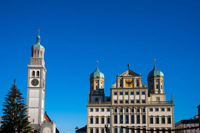Low angle view of church against clear blue sky