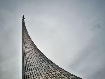 Low angle view of building against cloudy sky