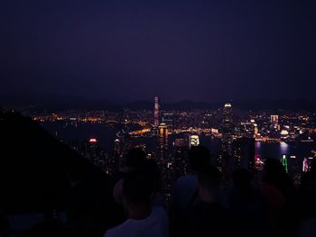 Crowd looking at illuminated city