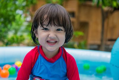 Portrait of smiling boy in swimming pool