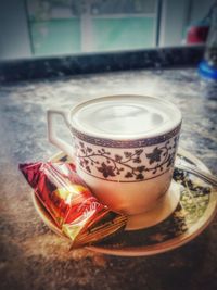 High angle view of coffee cup on table