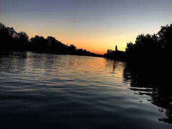 Scenic view of lake against sky during sunset