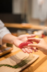 Cropped hands of person preparing food