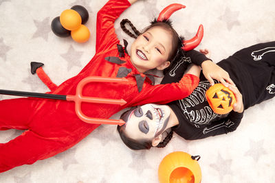 High angle view of woman lying down toy