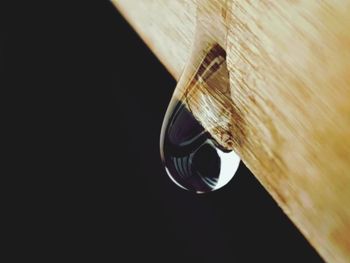 Close-up of wood against black background