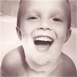 Portrait of smiling boy in bathroom