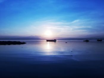 Scenic view of sea against sky at sunset