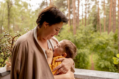 Happy grandmother and grandson enjoy time together. positive middle age woman 