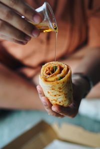 Midsection of person preparing food