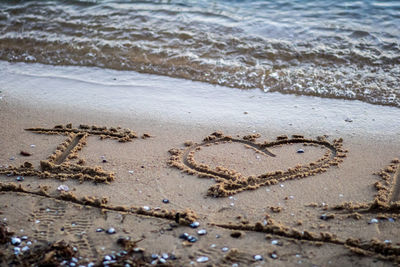 Heart shape on sand at beach