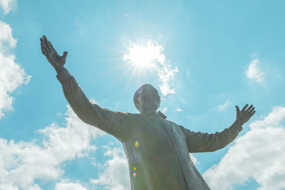 Low angle view of statue against sky