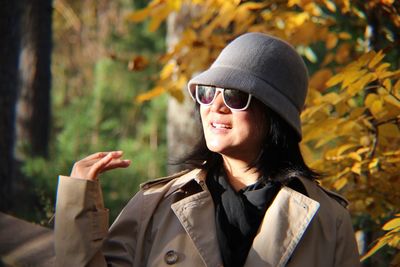 Woman wearing sunglasses hat outdoors