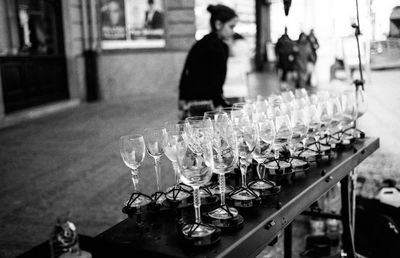 Full frame shot of glass bottles on table in city