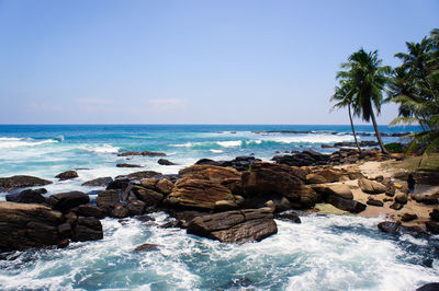 Scenic view of sea against clear blue sky