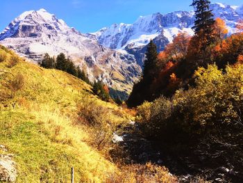 Scenic view of snowcapped mountains against sky