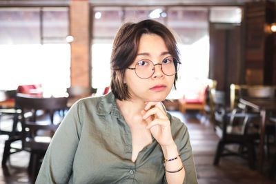 Portrait of a young woman in restaurant